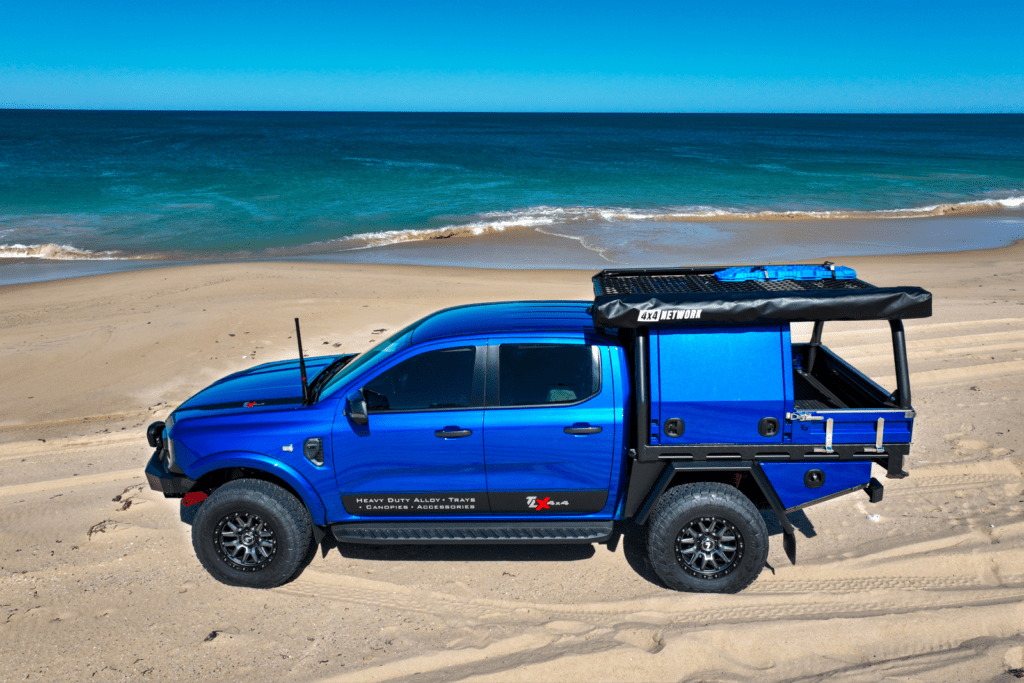 blue tlx ute on beach