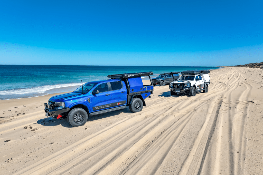 tlx blue ute on beach